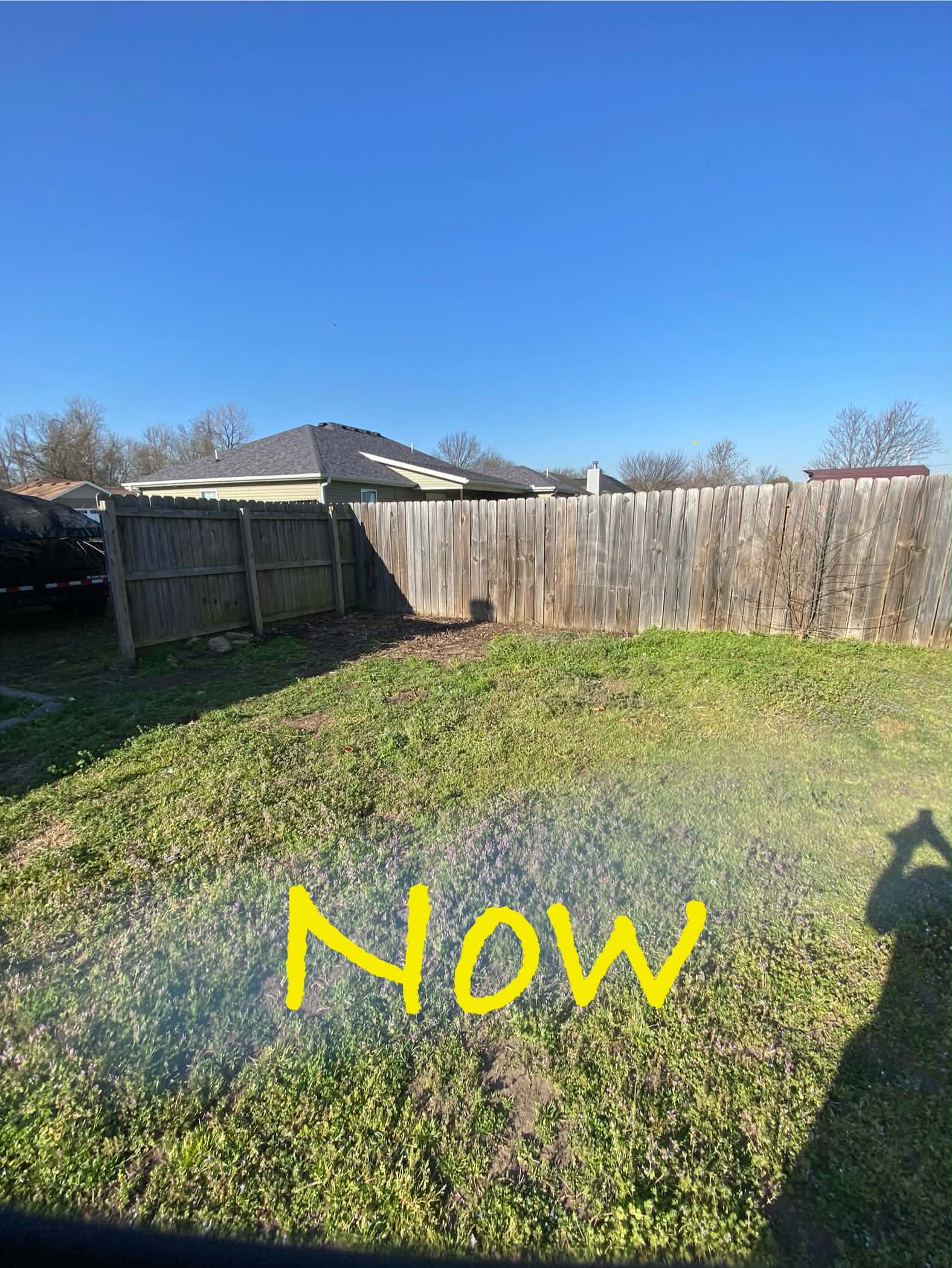 The same backyard cleared after the unwanted items were removed