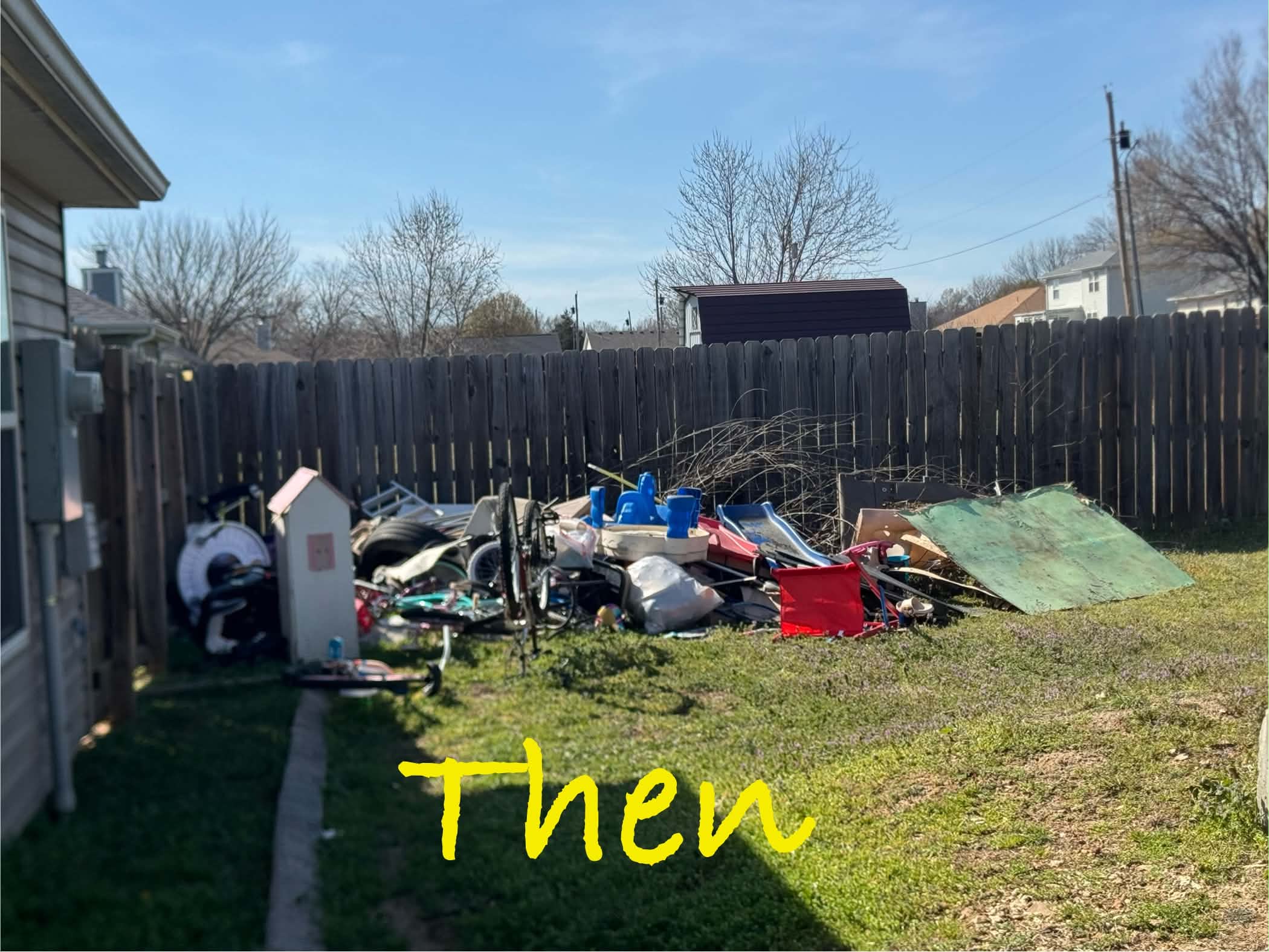 Backyard with a pile of unwanted household items before removal